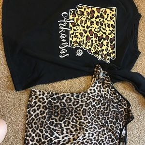 Two leopard print shirts. Both never worn!!